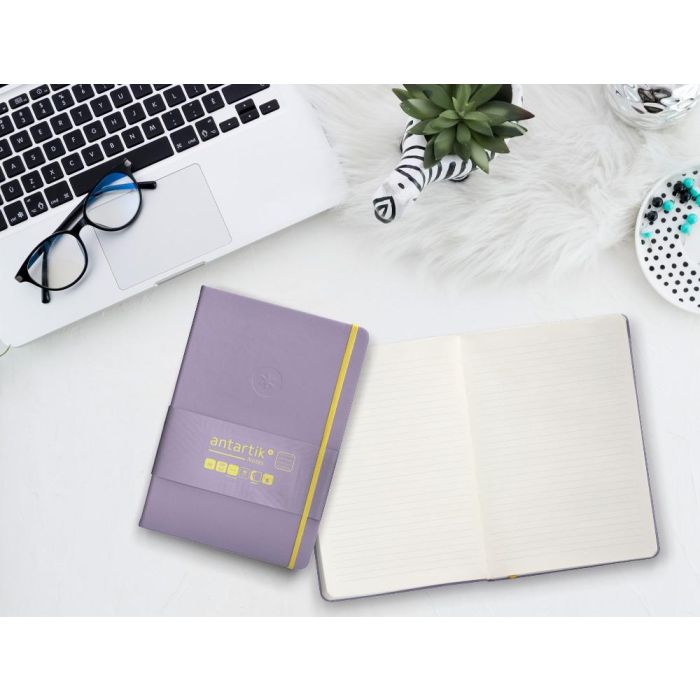 Cuaderno Con Gomilla Antartik Notes Tapa Dura A5 Hojas Rayas Morado Y Amarillo 100 Hojas 80 gr Fsc 10