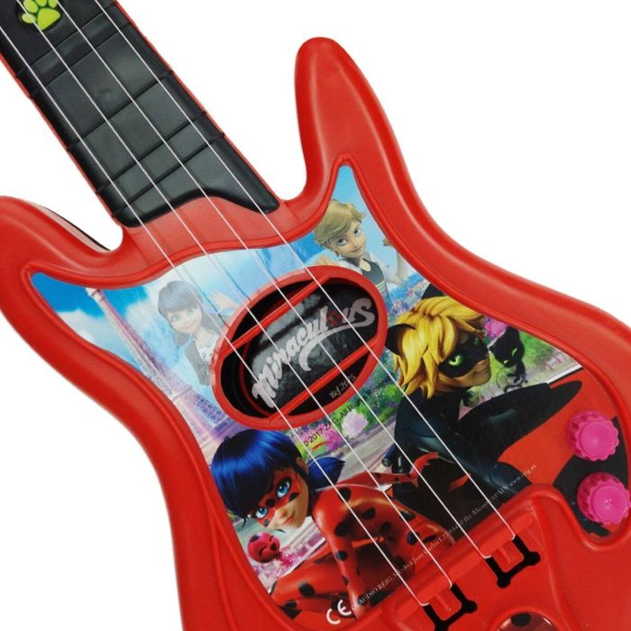 Microfono de pie con amplificador y guitarra lady bug 4