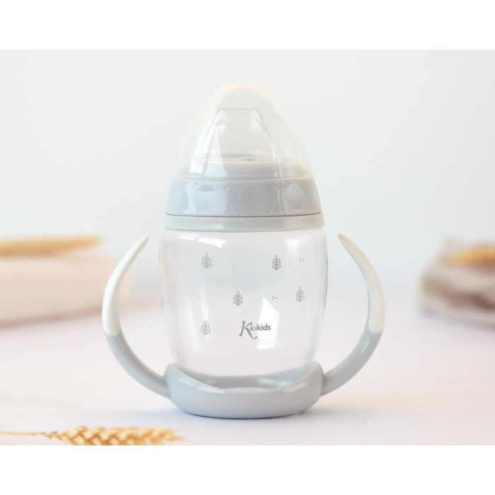 KioKids Taza de Aprendizaje Step 1 con Tetina de Silicona Suave Antiderrames y Anticólico con Asas +6 Meses Color Gris