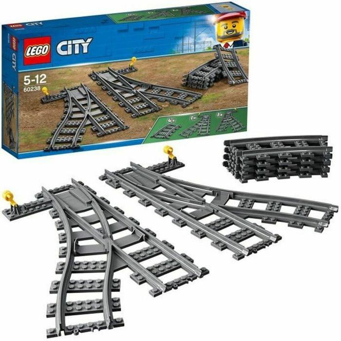 LEGO 60238 City Conjunto de Rieles de Tren y Desvíos. Incluye 4 Curvos, 1 Desvío Derecho y 1 Izquierdo. Compatible con todos los conjuntos LEGO City. LEGO 60238 City Conjunto de Rieles de Tren y Desvíos. Incluye 4 Curvos, 1 Desvío Derecho y 1 Izquierdo. Compatible con todos los conjuntos LEGO City.