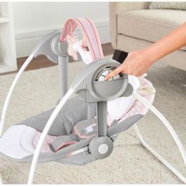 Ingenuity Columpio compacto Ingenio Flora con 6 velocidades, 12 melodías, barra de juegos y reposacabezas de unicornio para bebé niña