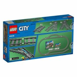 LEGO 60238 City Conjunto de Rieles de Tren y Desvíos. Incluye 4 Curvos, 1 Desvío Derecho y 1 Izquierdo. Compatible con todos los conjuntos LEGO City. LEGO 60238 City Conjunto de Rieles de Tren y Desvíos. Incluye 4 Curvos, 1 Desvío Derecho y 1 Izquierdo. Compatible con todos los conjuntos LEGO City.