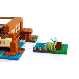 LEGO 21256 Minecraft La Casa de la Rana, Juguete con Minifiguras de Animales, Personajes: Zombi y Explorador